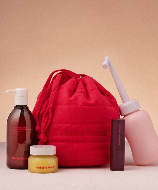 A Medicine Mama hospital bag containing the Pregnancy to Postpartum: Total Care Gift Set - PREORDER Ships 1/26/24 and a bottle of water for postpartum care.