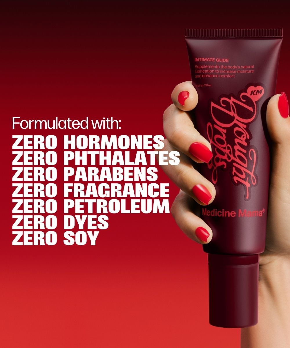 A hand holds a maroon tube labeled Drought Drops. Text beside it highlights that this gentle vaginal moisturizer is made without hormones, phthalates, parabens, fragrance, petroleum, dyes, or soy. The background features a red gradient.