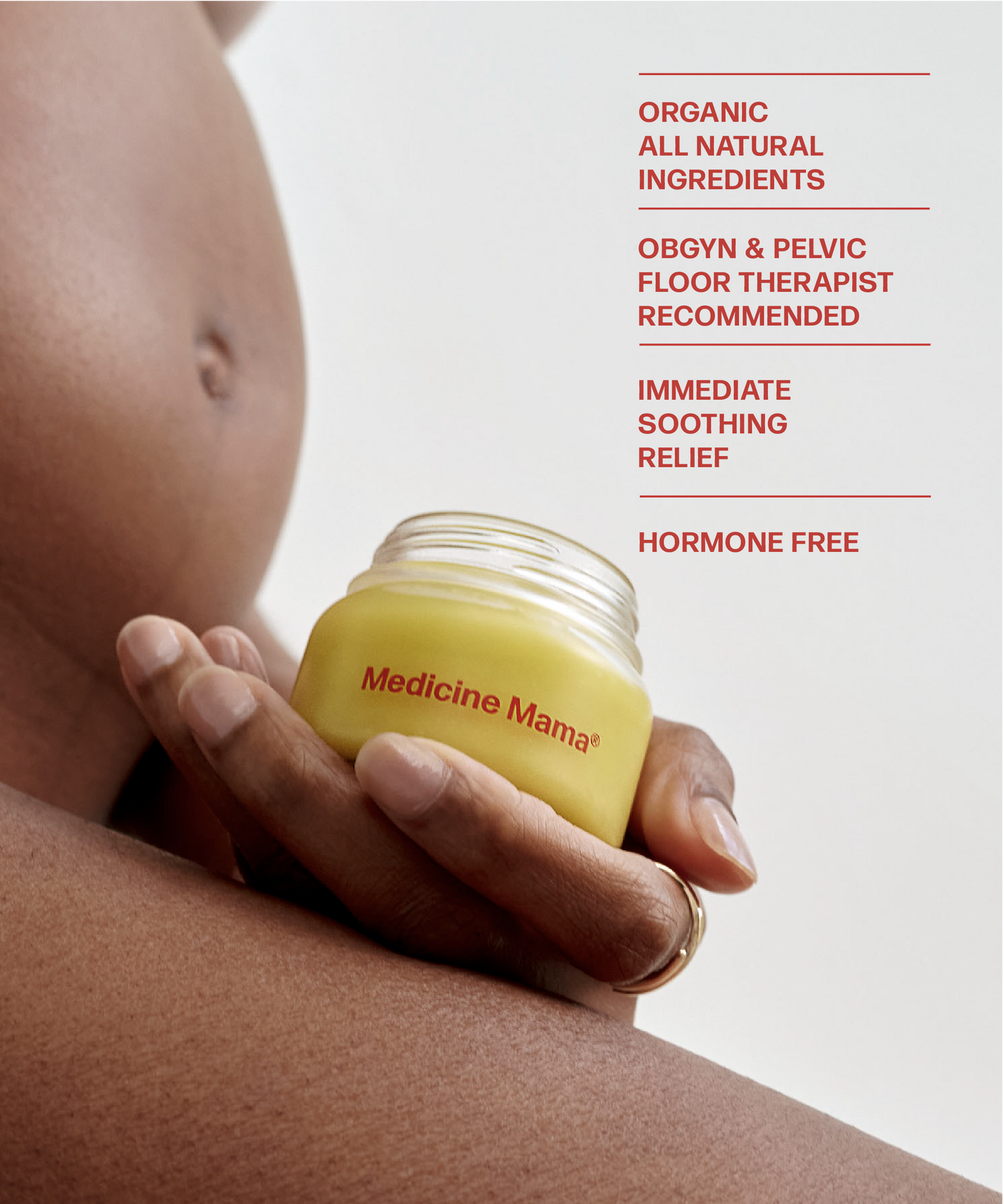 A pregnant woman holding Wholesale VMAGIC® Vulva Balm by Medicine Mama, an intimate skincare moisturizer.