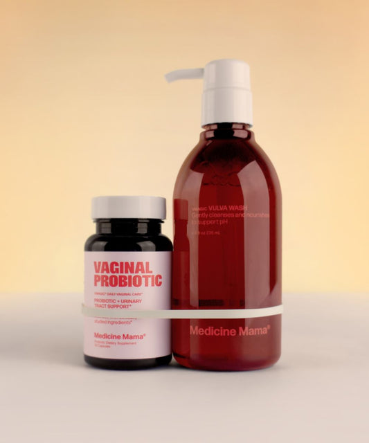 Two Medicine Mama’s Vaginal Balance Duo—featuring a dark bottle of Vaginal Probiotic with a white cap and a larger pump bottle of Vulva Wash—is displayed against a warm beige background.