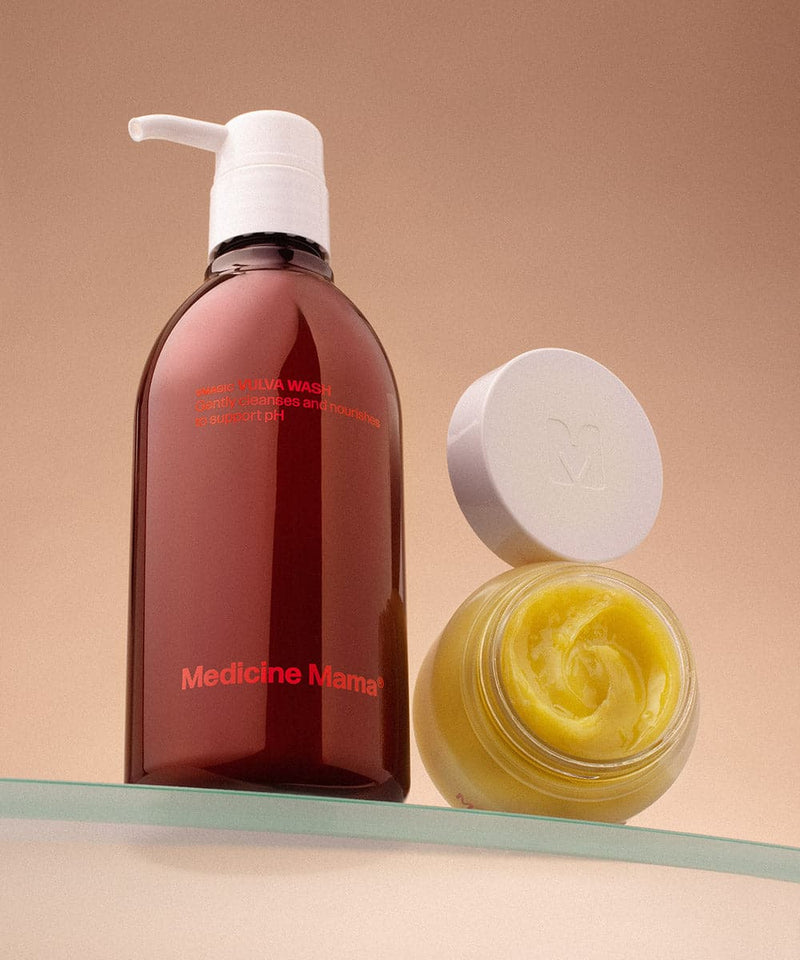 A brown bottle and an open jar from the VMAGIC® Daily Care Duo: Balm & Wash, ideal for gentle vulva care, are displayed with a white pump and lid against a neutral beige background.