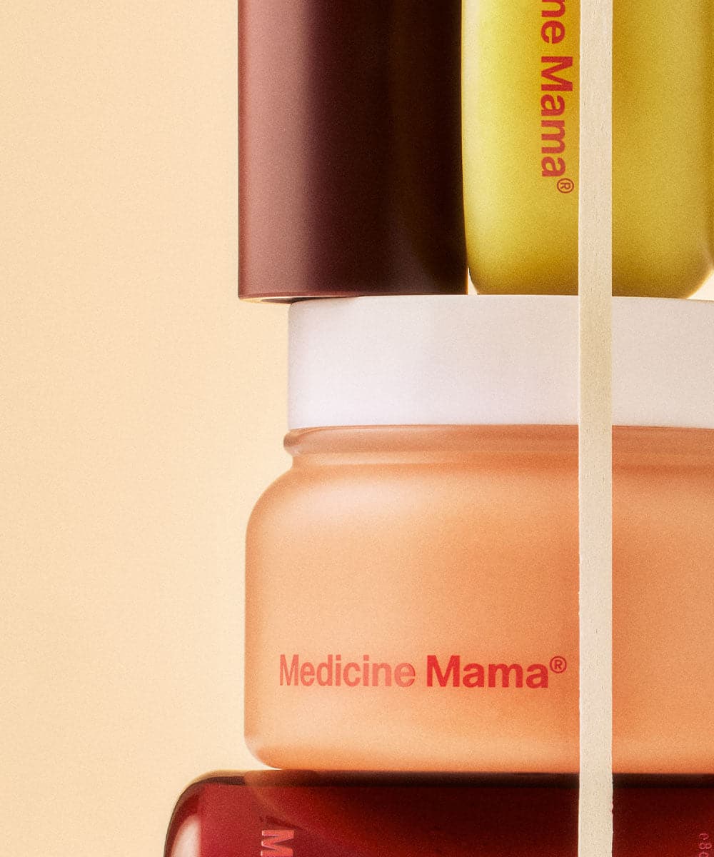 A stack of jars stacked on top of each other filled with VMAGIC® Grooming Polish by Medicine Mama.